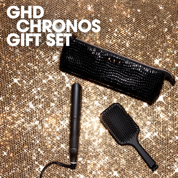 GHD Chronos gift set with hair dryer, straightener, and brush on a glittery background
