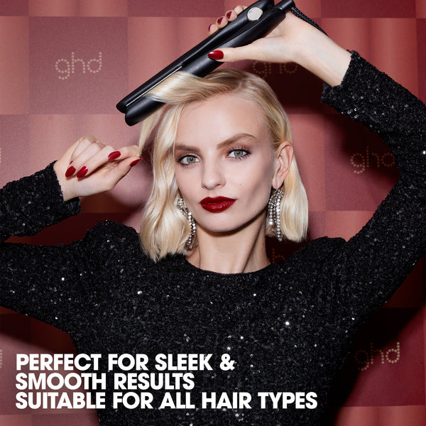 Woman using a ghd hair straightener with text about product features.