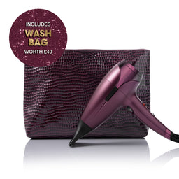 Purple hair dryer with a matching bag on a white background