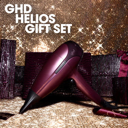 Purple hair dryer with 'GHD Helios Gift Set' text on a glittery background