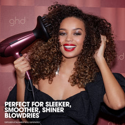 Woman using a ghd hair dryer with text about hair care product benefits