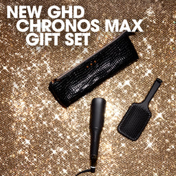New GHD Chronos Max gift set with hair styling tools on a textured gold background