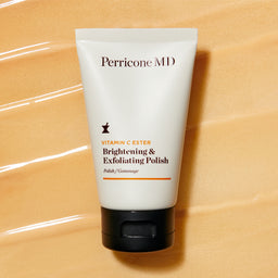 Perricone MD Vitamin C Ester Brightening & Exfoliating Polish tube on a layer of texture