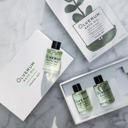 an open box of Olverum Bath Oil Travel Set showing the travel bottles inside