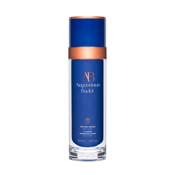 Blue skincare bottle with bronze cap on a white background