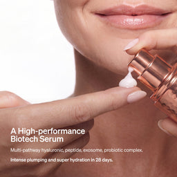 Close-up of a person applying a white serum from a rose gold pump bottle onto their finger, with promotional text on a white background.