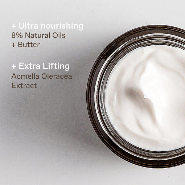An open jar of white cream or balm on a light gray background with text highlighting ingredients: 'Ultra nourishing 8% Natural Oils + Butter' and 'Extra Lifting Acmella Oleracea Extract'.