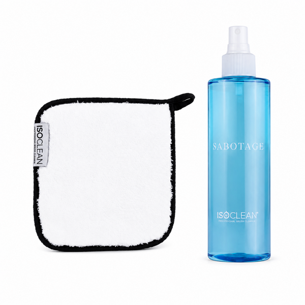 ISOCLEAN cleaning kit featuring a white microfiber cloth with a black border and a translucent blue spray bottle labeled SABOTAGE.