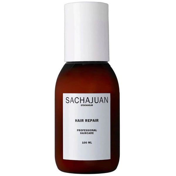 Sachajuan Stockholm Hair Repair professional haircare in an amber brown bottle with a white cap and white label, on a plain white background.