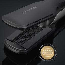 Black hair straightener with brand logo on a dark background