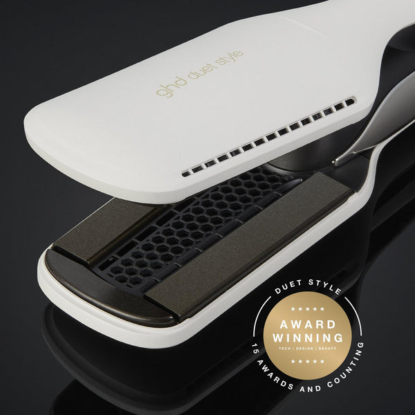 Hair straightener with a gold badge on a black background