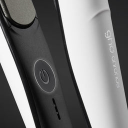 Close-up of a black and white electronic device with 'Sony' branding on a dark background