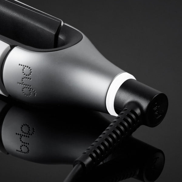 Close-up of a white and black device with 'Bilt' branding on a reflective surface.