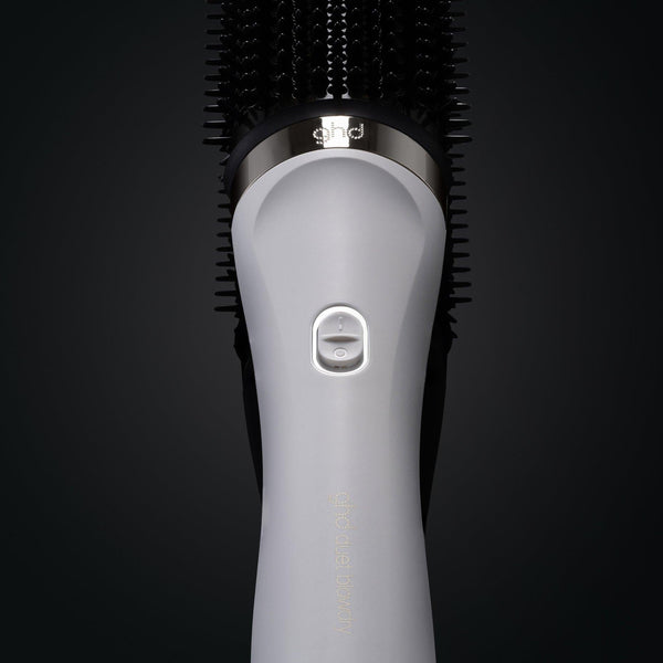 Gray hairbrush with bristle head on a black background