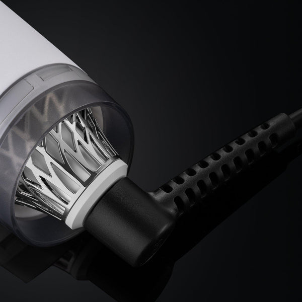 Close-up of a hair dryer with a black background