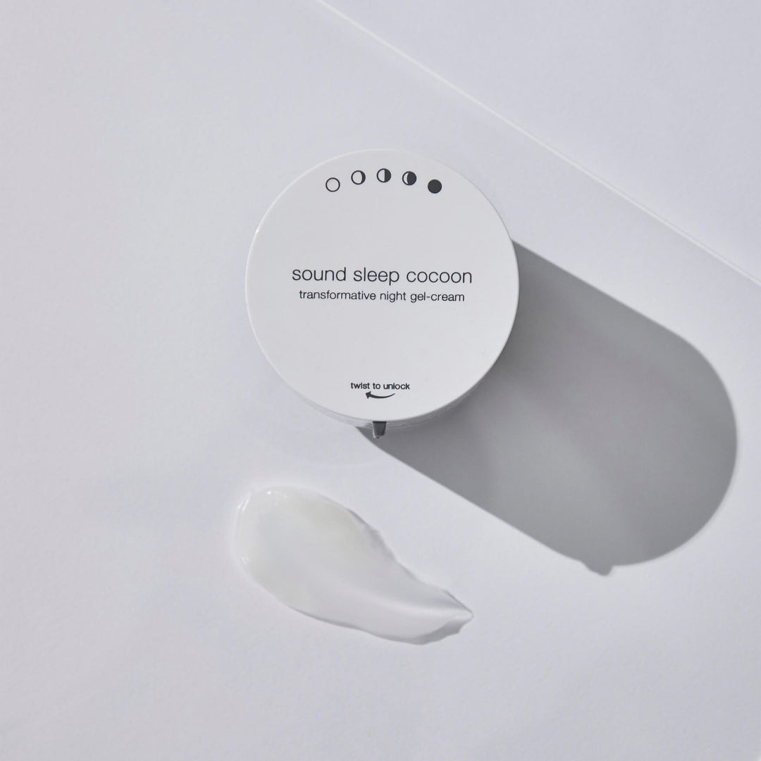 Round container of 'sound sleep cocoon' transformative night gel-cream on a light gray background