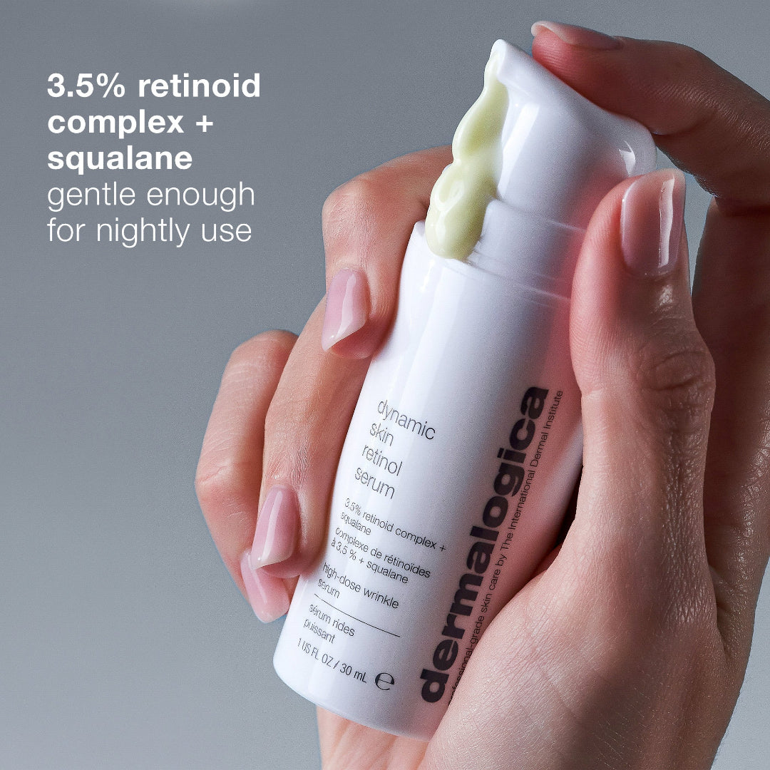 Hand holding a Dermalogica dynamic skin retinol serum with product details on a gray background