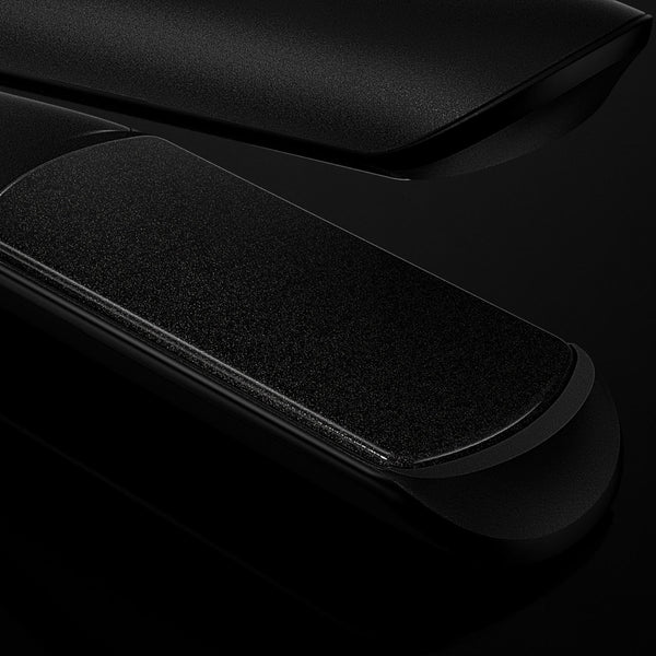 Black electronic device with circular component on a dark background