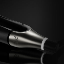 Black and silver electronic device with 'pyrol' branding on a black background