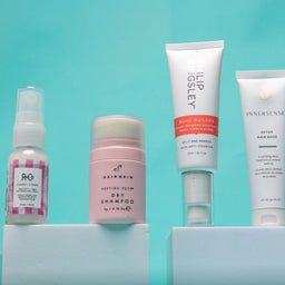 Collection of skincare and hair care products on a light blue background