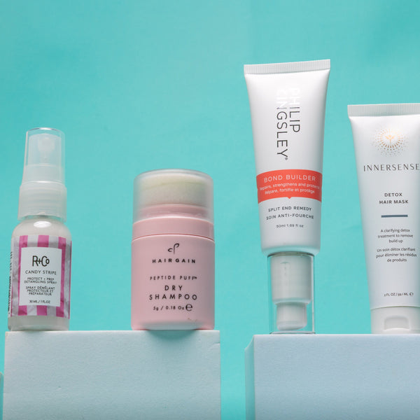 Collection of skincare and hair care products on a light blue background