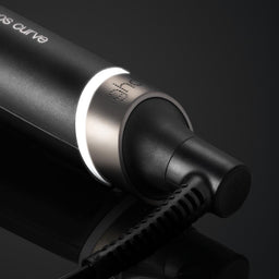 Black electronic device with 'Osmio' branding on a reflective surface