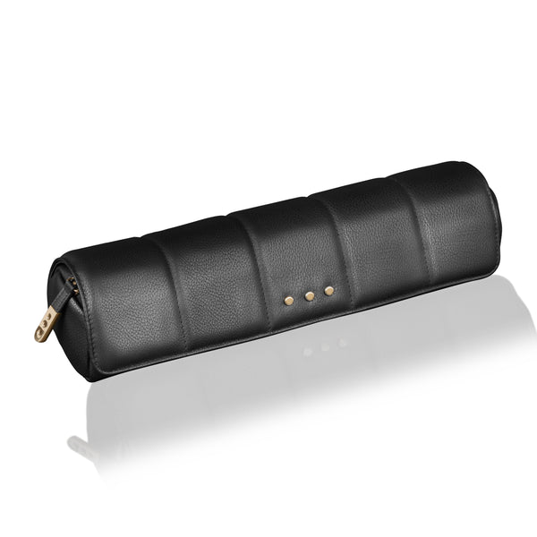 Black leather travel case with gold zippers on a white background
