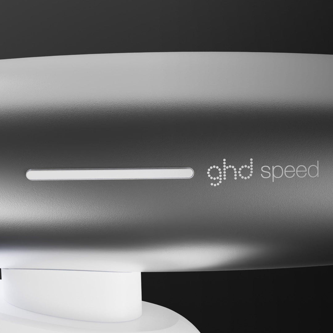 GHD Speed hair dryer on a black background