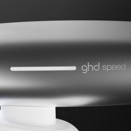 GHD Speed hair dryer on a black background