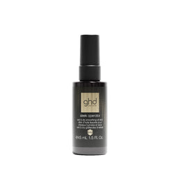 GHD Silk Operator wet and dry smoothing oil in a 1.5 fl. oz. black spray bottle, shown on a solid white background.