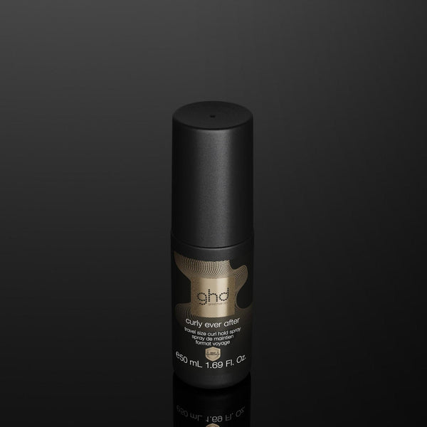 A single black cylindrical cosmetic bottle with a metallic gold label reading 'ghd' and 'Super Smooth Hair Smoother' on a dark reflective black background.