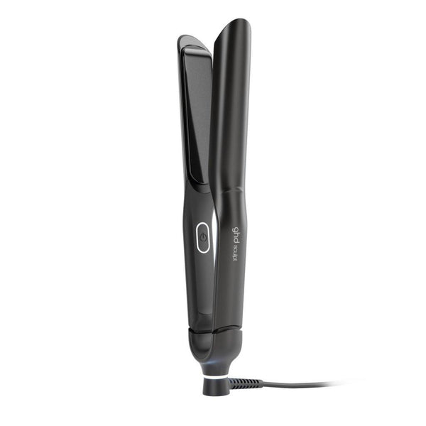 A black flat iron hair straightener with a power button and a small white logo on the handle, shown on a plain white background with its cord visible.