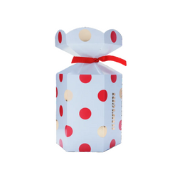 A light blue octagonal gift box with red and beige polka dots, tied with a red ribbon at the neck, shown on a plain white background.