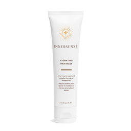 A white tube of Innersense Hydrating Hair Mask with gold and brown text and logo, set against a plain white background.