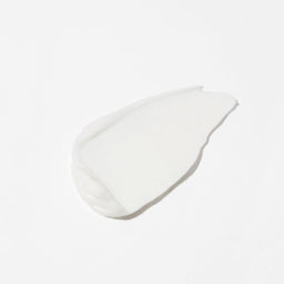 A dollop of smooth, opaque white cosmetic cream or gel on a clean white background.