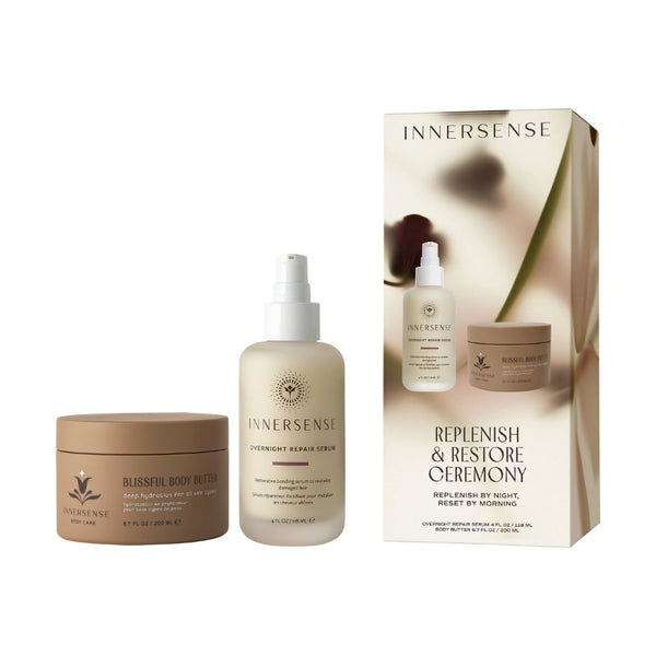 Innersense Replenish & Restore Ceremony gift set featuring a Blissful Body Butter jar, a Overnight Repair Serum bottle, and the product packaging box on a white background.