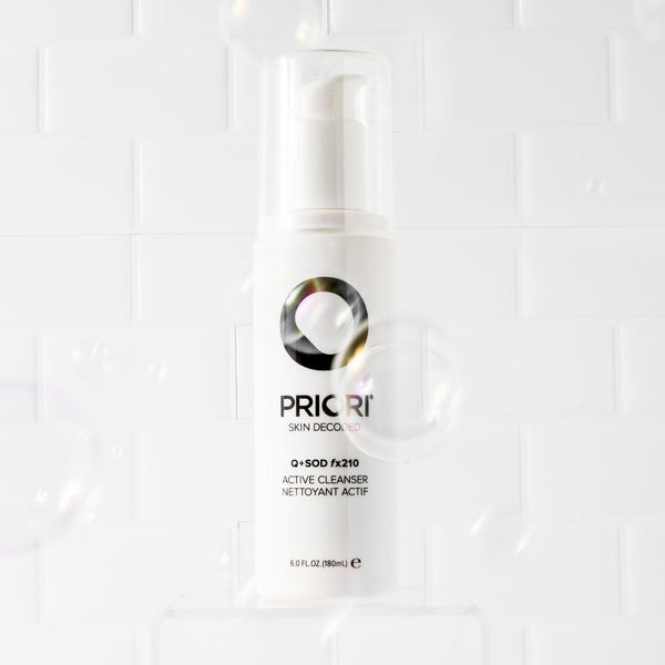 PRIORI Q+SOD - Active Cleanser bottle with bubbles around it