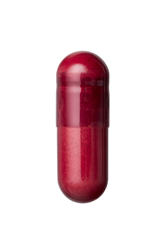Red cylindrical object on a white background