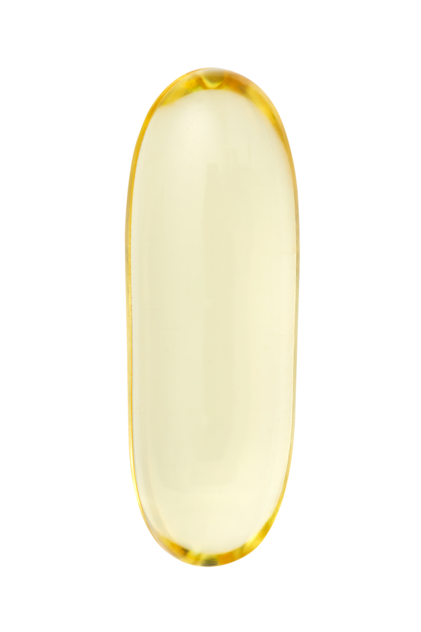Yellow gel cap on a white background