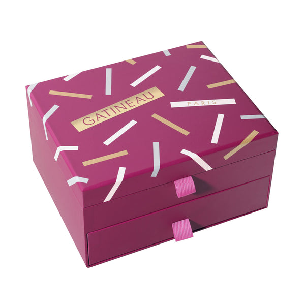 Pink jewelry box with white and gold accents on a white background