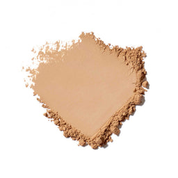 Heart-shaped pile of beige powder on a white background