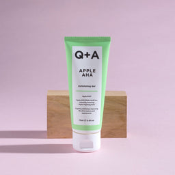 Gift: Q+A Apple AHA Exfoliating Gel 75ml in front of a wooden block