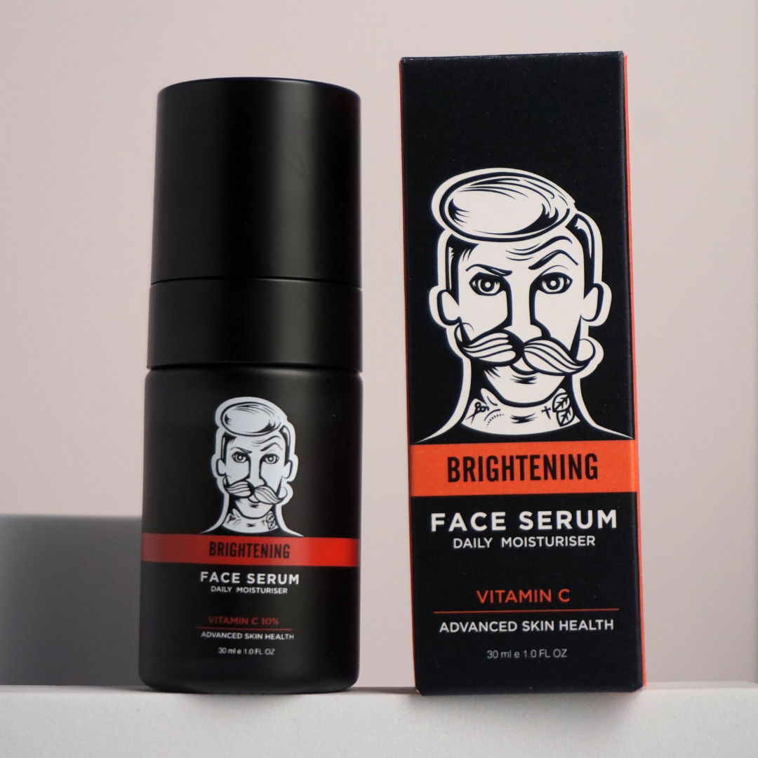 Black face serum bottle with packaging featuring a stylized face design on a light gray background.