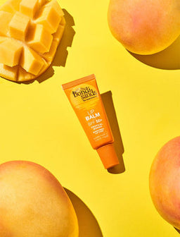 Bondi Sands Lip Balm SPF50+ Tropical Mango surrounded by mangos