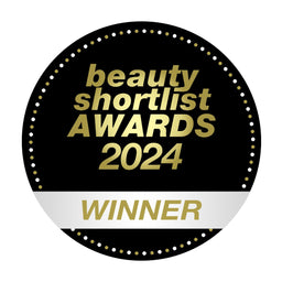 A circular black and gold badge reading 'beauty shortlist AWARDS 2024' with a white horizontal band at the bottom and the word 'WINNER' in gold, shown on a plain white background.