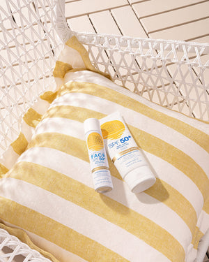 Bondi Sands Face Mist SPF50+ placed on a sun bed