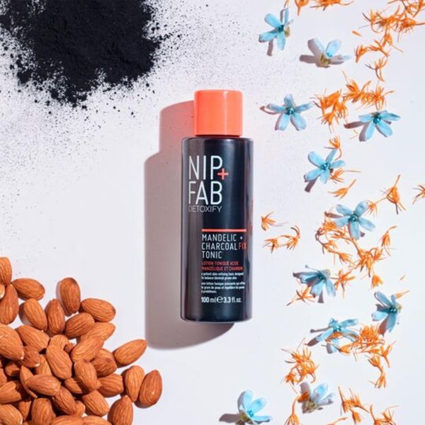 Nip+Fab Charcoal Fix & Mandelic Acid Tonic bottle in the centre of its active ingredients 
