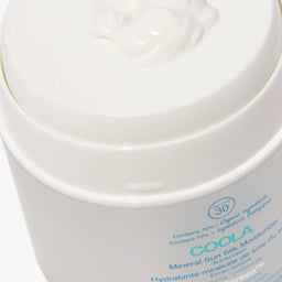 COOLA 360 Moisturising Sun Cream tub with an open lid revealing its contents