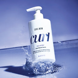 Color Wow Curl Wow Flo-etry Vital Natural Serum dropped into water