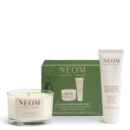 NEOM Welbeing London Calming Home & Body Duo gift set, featuring a green gift box, a white body butter tube, and a white scented candle in a clear glass jar, arranged on a white background.